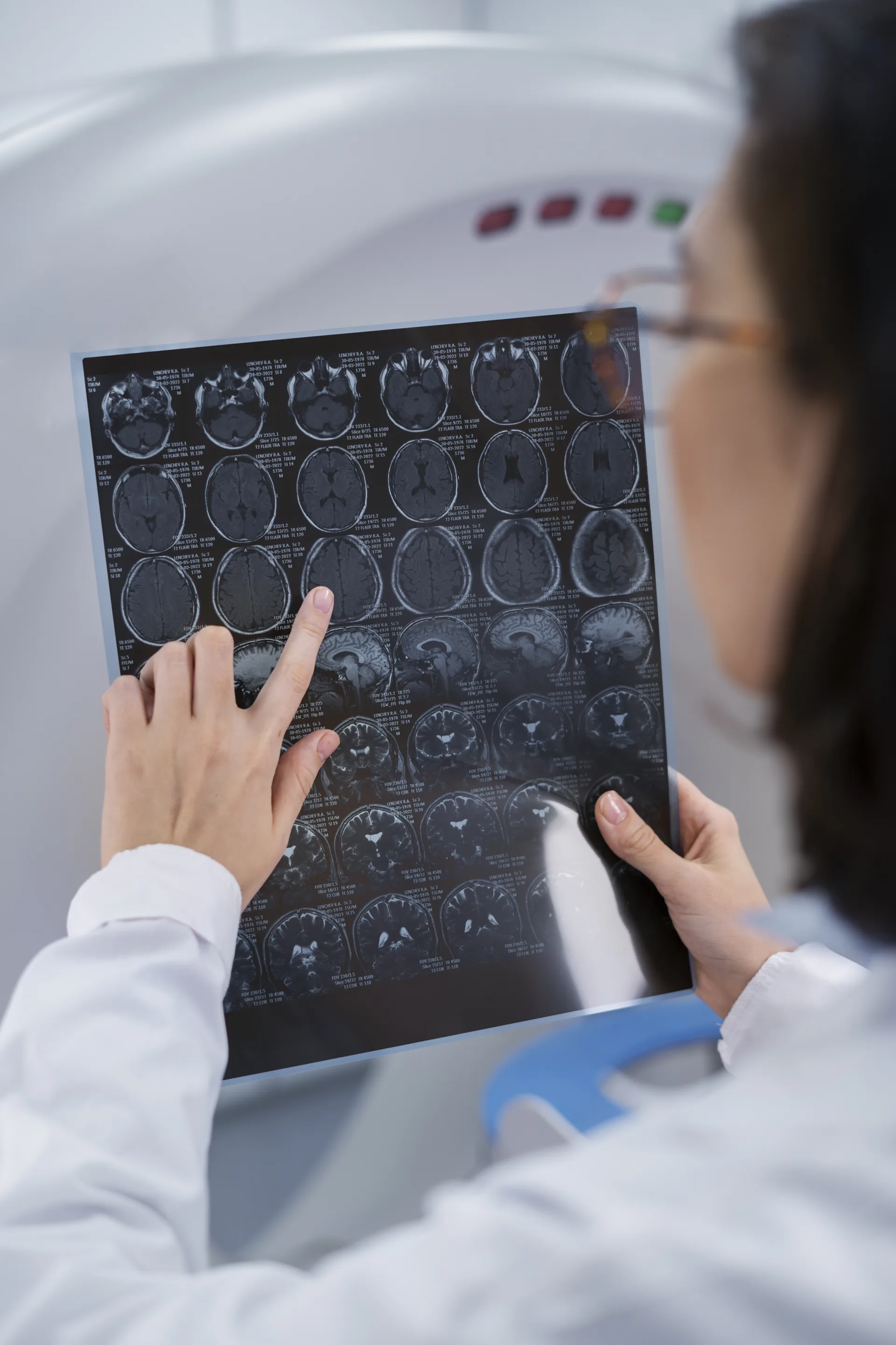 Neurologist reviewing brain scan for EEG, NCV and EMG diagnostics at NeuroMet Wellness Gurgaon