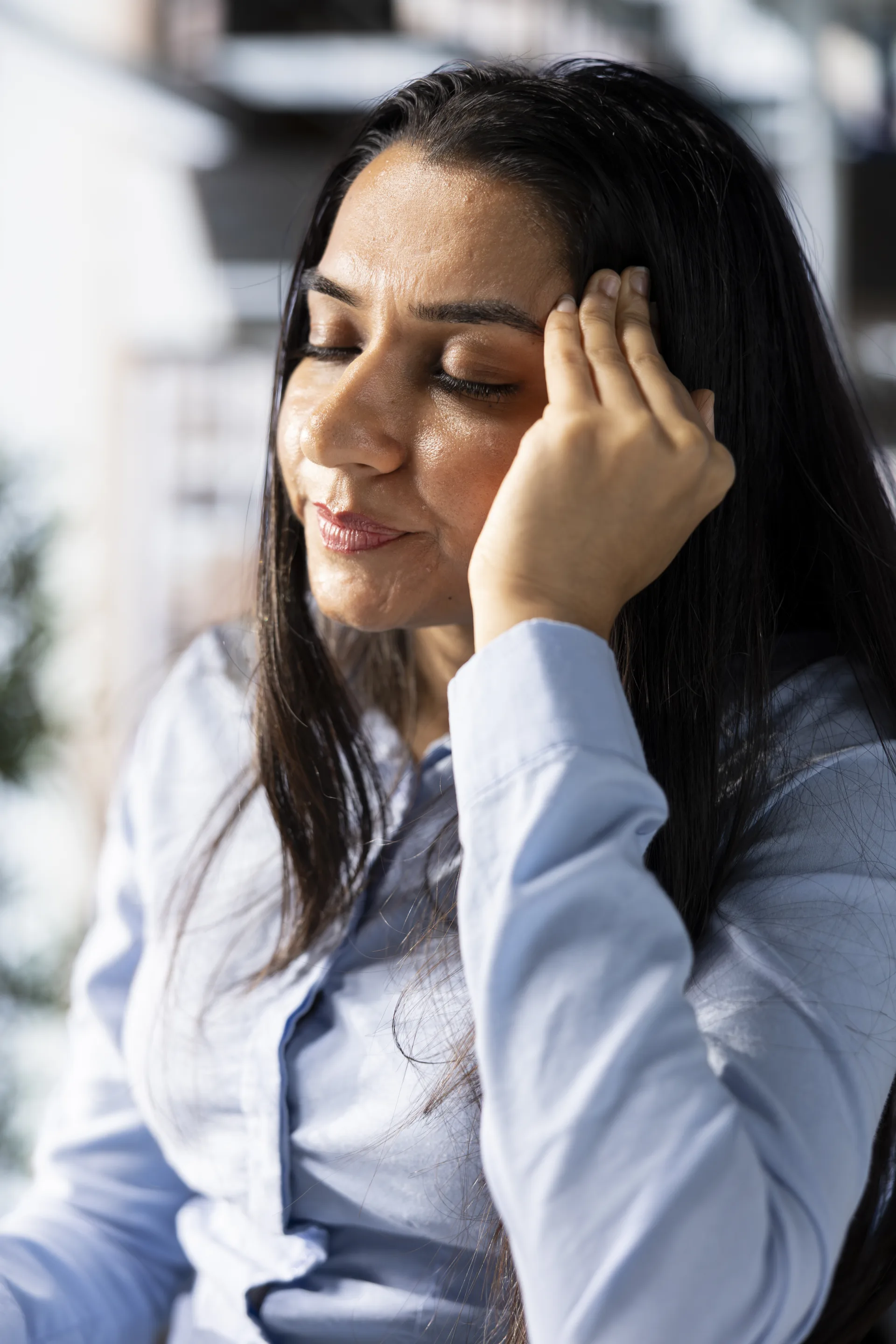 Professional experiencing a stress headache — treated at NeuroMet Wellness Headache & Migraine Clinic Gurgaon